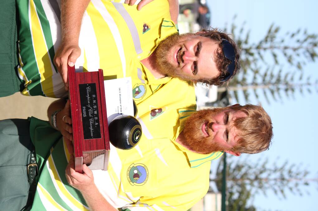 Chris Herden (left)  and Nick Golledge celebrate  a State Champion of Champions Pairs final win at Port Macquarie yesterday. Photo: Andrew Lynn (Bowls NSW)