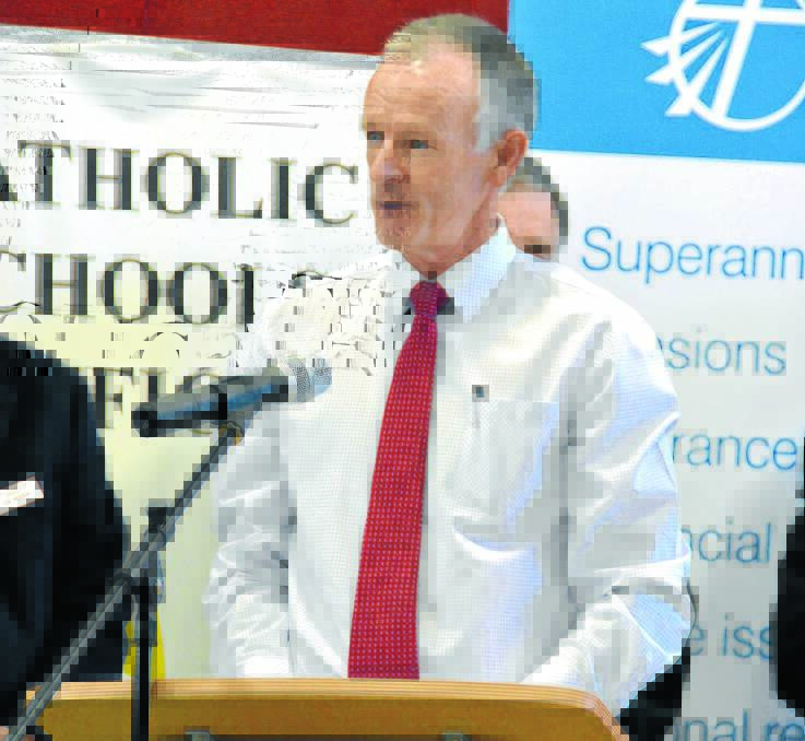 REWARDING: Tamworth’s Bede Maher accepting his award at the 2014 Spirit of Catholic Education Awards.