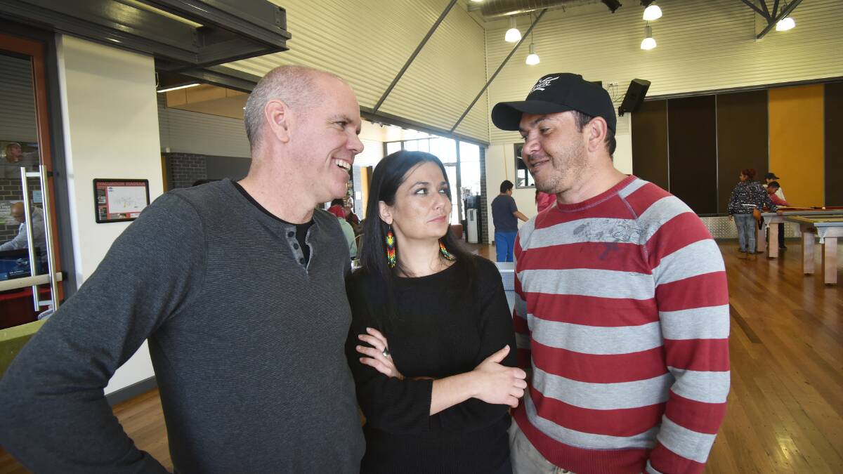 SHARING IDEAS: Michael Hutchings of APRA AMCOS, Sydney artist Leah Flanagan and local Indigenous artist Scotty Troutman sharing ideas at Tamworth Youthie. Photo: Geoff O'Neill 290615GOC01
