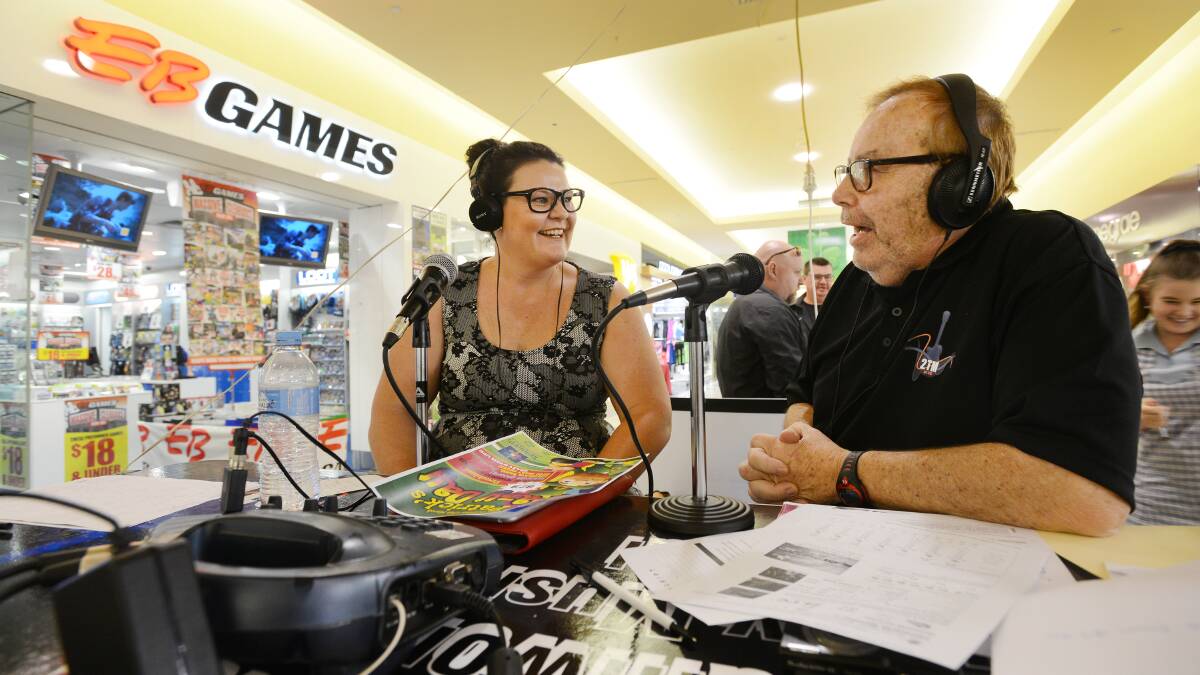EIGHTY YEAR BRODCAST: 2TM has celebrated its 80th birthday with an outside broadcast from Tamworth Shoppingworld with Shoppingworld marketing manager Donna Carey and announcer Graham Archer on air. Photo: Barry Smith 250215BSF02
