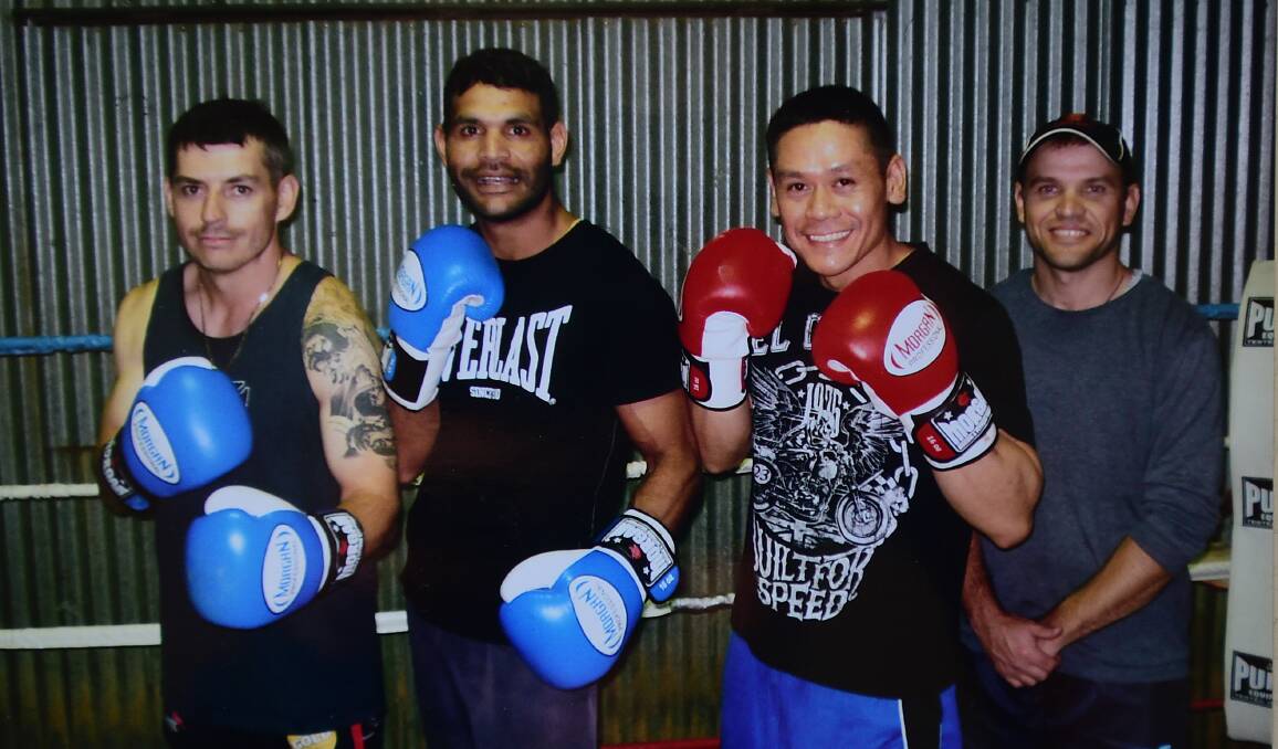 Westside boxers (from left) Jamie Carroll, Mark Morgan and  Ryan Ferrier with coach Chris Dickson, had wins at Newcastle recently. Absent is Jacob Stanton.