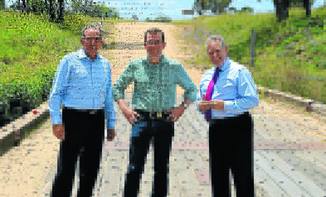 FUNDING WINNER: Northern Tablelands MP Adam Marshall, centre, with Anthony Michael, left, and Paul Henry, of Inverell Shire, on Tin Tot Bridge earlier this year. The council secured $800,000 in funding for the replacement of the bridge under the Fixing Country Roads program.