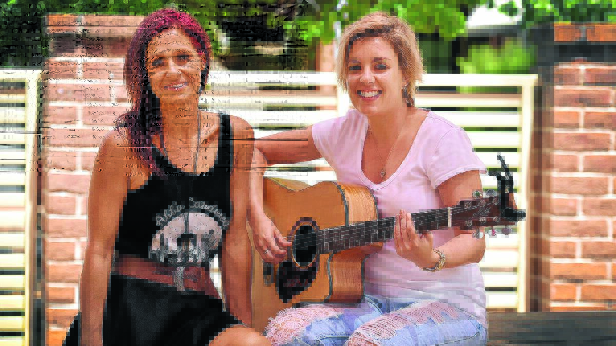 LESSONS FROM THE STARS: Guest speaker Kasey Chambers with academy student and nurse Emma Dykes discuss the finer points of country music. Photo: Geoff O’Neill 050116GOD01