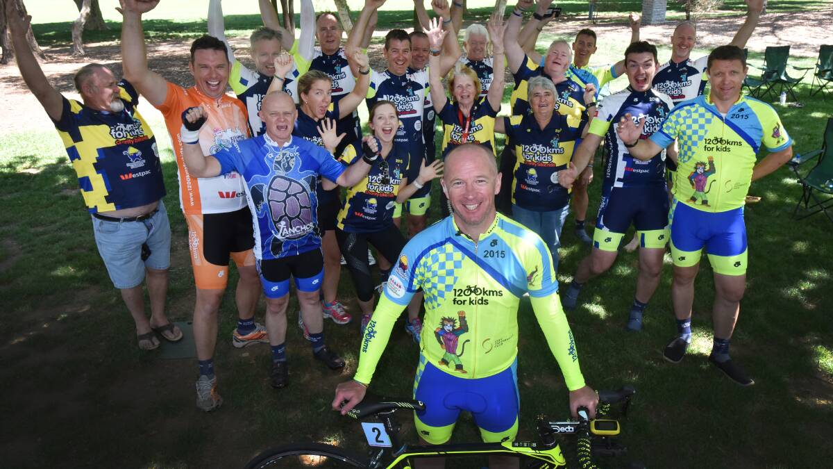 FOR THE KIDS: The 1200kms for Kids charity bike ride rolled into Tamworth yesterday and organiser Darryl Dixon, front, was pleased to donate more than $2000 to the Tamworth hospital. Photo: Geoff O’Neill 201015GOC01