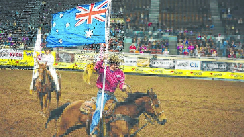Ty Parkinson rides the Australian flag into the Oklahoma City stadium for the 2015 World IPRA Finals. Photo: Emily Gethke Photography.
INSET – Luke Morgan receives his World IPRA saddle bronc title from Miss USA Rodeo 2015 and 2016. 