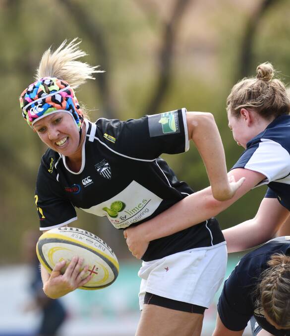 Katrina Fry takes the ball up for Central North against New England on Saturday in the Country Women’s Rugby Championships in Tamworth. Photo: Gareth Gardner 300416GGC16