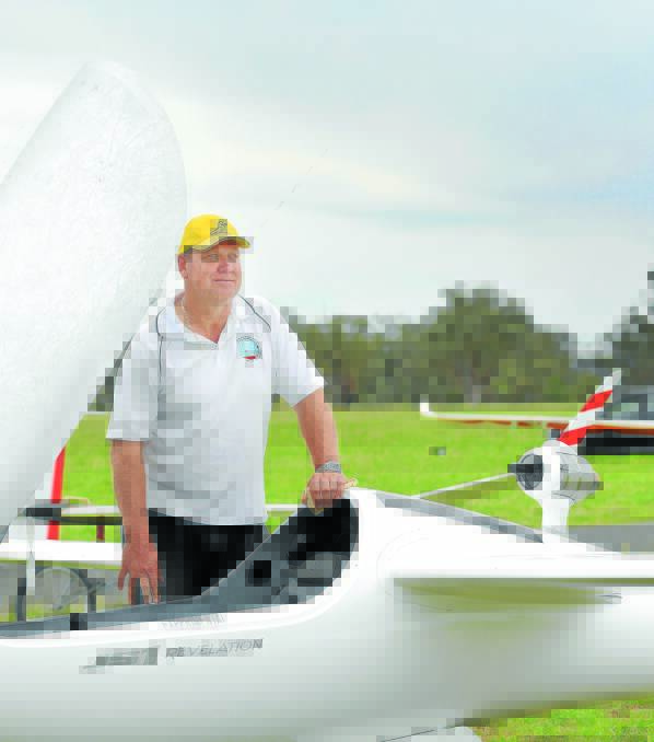 JET POWER: Andrew Georgeson from Brisbane shows off a jet engine attached to his glider. 121115GGA01
