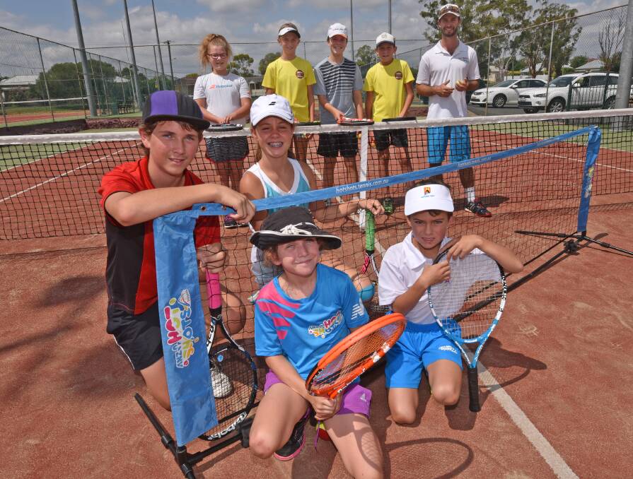 Fronting up for free tennis this Saturday will be some of these talented young juniors (front from left) Sophie Brooking, Matthew Keen (second row from left) Caden Brooking, Grace Collins (back from left) Davina Cameron, Avril Gardner, Rory Cameron, Cameron Blundell and West Tamworth  coach Mitch Power. Photo: Geoff O’Neill 250116GOC01