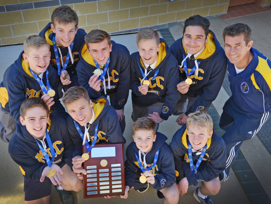 The McCarthy Catholic College Year 7/8 Boys’ side claimed the NSW CCC title last week. (Front from left)  Izack Fuller, Samuel Ellicott, Tom Sheppard and David Murrie. (Back from left)  Brock McMahon, Nathan Watson, Cooper Kelly, Jared Sing, Caleb Lavu Lavu and Paul Hobson (coach). Absent: Tom Lange.  Photo: Barry Smith 310815BSB02