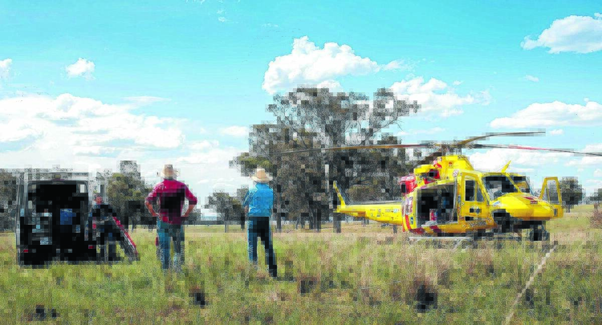 RESCUE MISSION: The Westpac Helicopter crew at the scene of Monday’s mission near Quirindi.