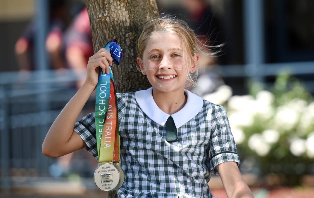Calrossy’s Alex Hayes shows off her two silvers from the Pacific School Games. 
Photo: Gareth Gardner 271115GGD002