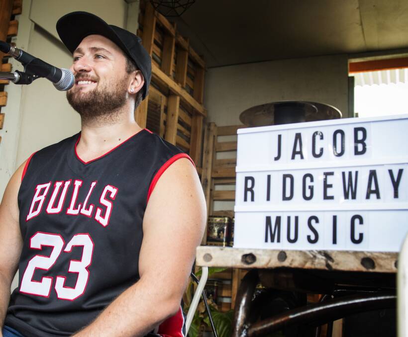 Looking for fame (and a few tips): Jacob Ridgeway, from Newcastle, drew big crowds when he busked in Peel St. He also played a few indoor gigs, such as Teamo Teahouse, above, during festival. Picture: Peter Hardin 260117PHA054