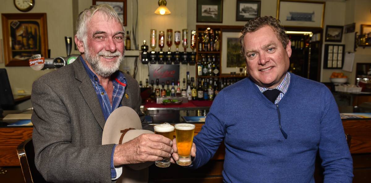 CHEERS: Tamworth Crime Prevention Committee chairman Russell Webb with Liquor Accord chair and publican Roger Rumble. Photo: Peter Hardin 