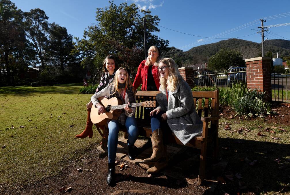 GRADUATES: Country stars Amber Lawrence and Lyn Bowtell, back, with junior academy students Hattie Oates and Chelsea Rollings. Photo: Gareth Gardner. 040717GGB06