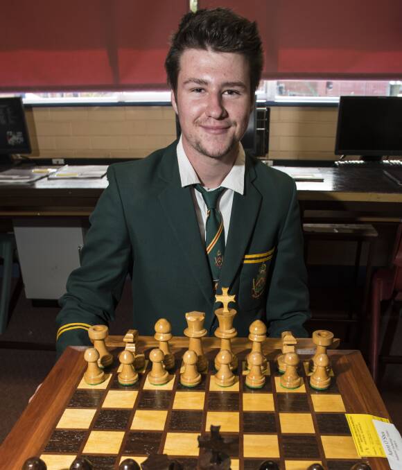 MAJOR PROJECT:  Farrer Industrial Technology student Aaron O'Shea with his chess set he made for his major HSC project. 010916PHA03