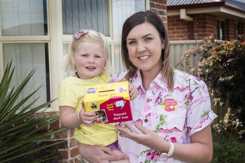 LOUD AND PROUD: Little Lacey Stubbs and her mum Kim urge locals to help kids receive the gift of hearing. Photo: Peter Hardin 171017PHE24
