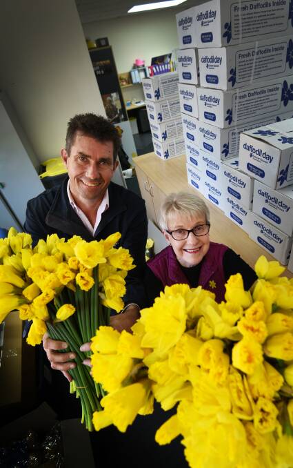 SPREAD THE WORD: Paul Hobson of the Cancer Council and volunteer Margaret Rock encourage residents to support Daffodil Day. Photo:Gareth Gardner 240817GGE01