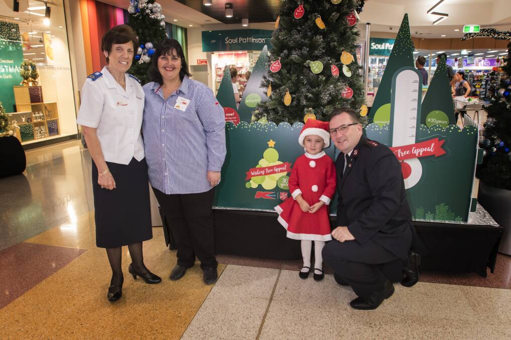 MAKE A WISH: Brenda Lodge of the Salvation Army with Kmart's Sharon Trickey, Willow Smith and Captain Dean Clutterbuck. Photo: Peter Clutterbuck 151117PHC007