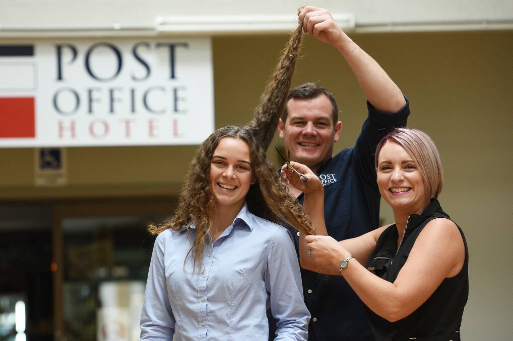 BIG SHAVE: Hannah Lye with Post Office Hotel publican Andrew Coutts and hairdresser Sammie Lye.Photo: Gareth Gardner 140217GGB02