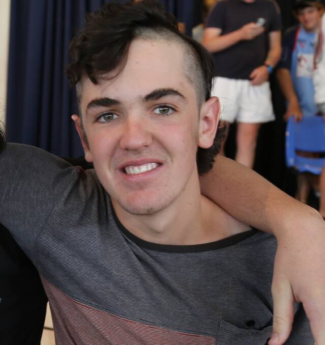 GOOD CAUSE: Year 12 student Will Brennan was happy to have his hair cut for the cause.
