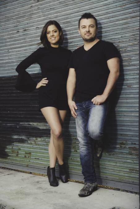 DYNAMIC: Country music stars Amber Lawrence and Travis Collins have joined forces in a new EP - Our Backyard. Photo: Supplied.