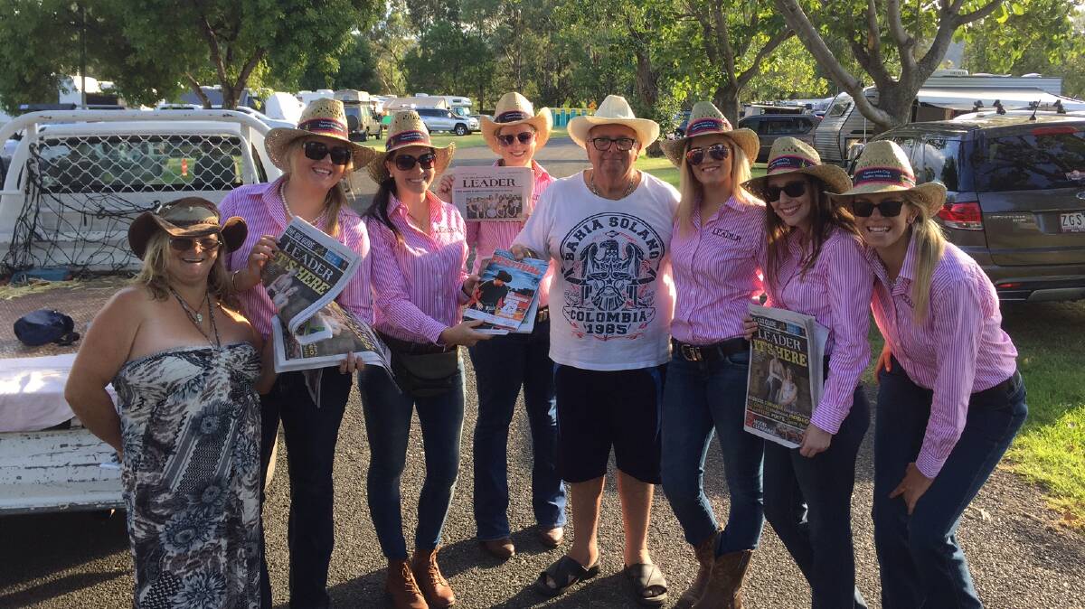 CONTESTANTS: Some of our Queen of Country Music Contestants delivering papers to happy campers in Tamworth on Friday.