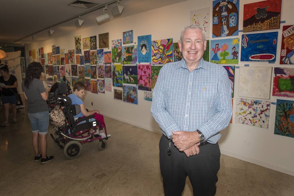 VOTING: Challenge Community Services CEO Barry Murphy at the art competition voting days this week with the winners to be announced on Friday. Photo: Peter Hardin 