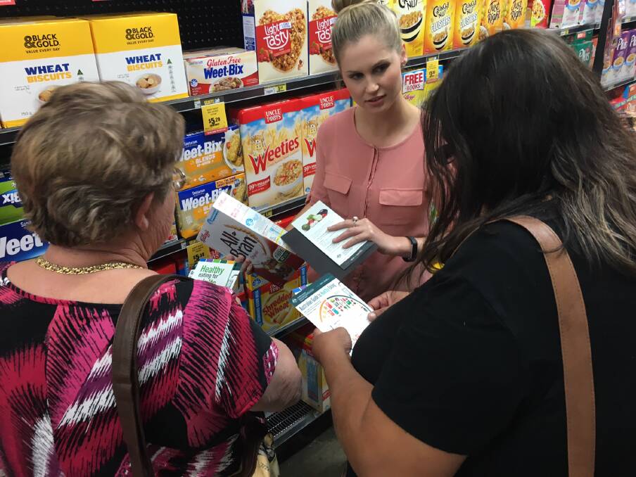 BETTER CHOICES: Karen Szpitalak speaks to community members about the right choices when grocery shopping. Photo: Supplied