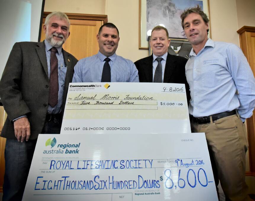 MONEY RAISED: Deputy mayor Russell Webb, left, with Cameron McFarlane, second from left, David Macallister and Jason Phillips.
