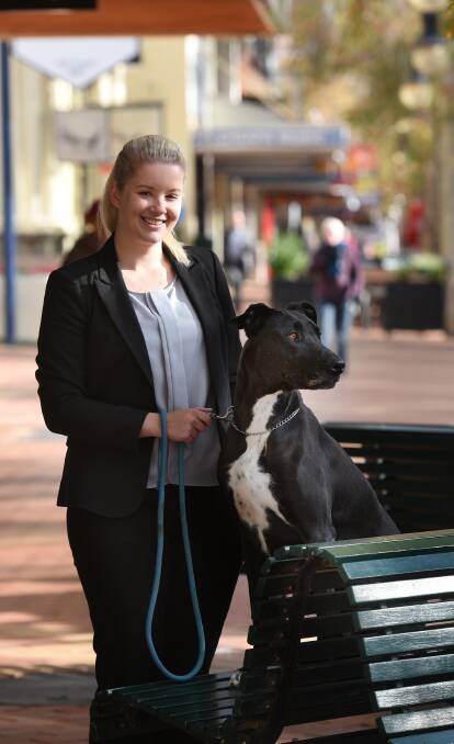 RESPONSIBLE: Sarah Fenn with her dog Tori invite you to take advantage of the discounts for seniors and pensioners. Photo: Gareth Gardner