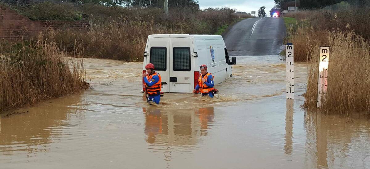 FLOOD RESCUES: State Emergency Services volunteers at an emergency flood rescue on Warral Rd which was one of two call outs early on Thursday morning.  Photo: Namoi SES