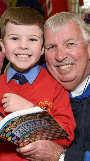 READING TIME: Brodie Stubbs enjoyed reading with his granddad Geoff O'Neill 220816PHA02