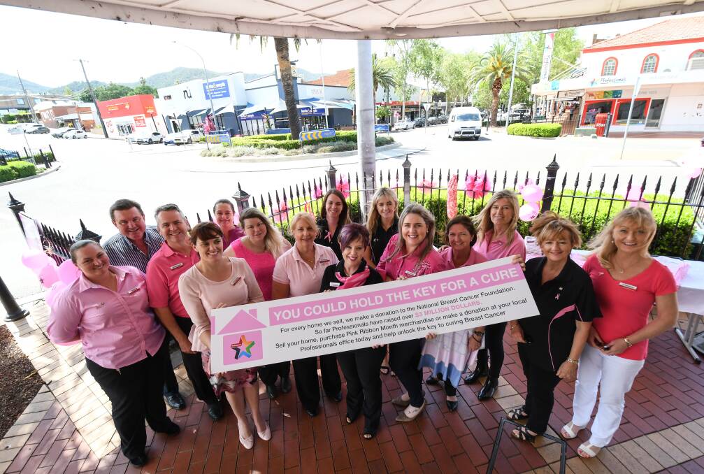 CANCER CRUSADERS: The staff from The Professionals in Tamworth raised money for cancer research with cupcakes and a merchandise stall on Monday. Photo: Gareth Gardner