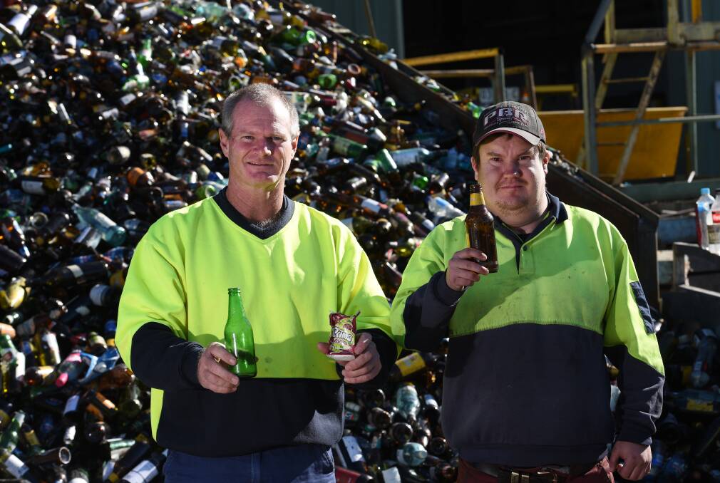 WAITING GAME: Recycling manager Victor Collett and employee Roland Caterer are waiting for the rollout to begin. Photo: Gareth Gardner 