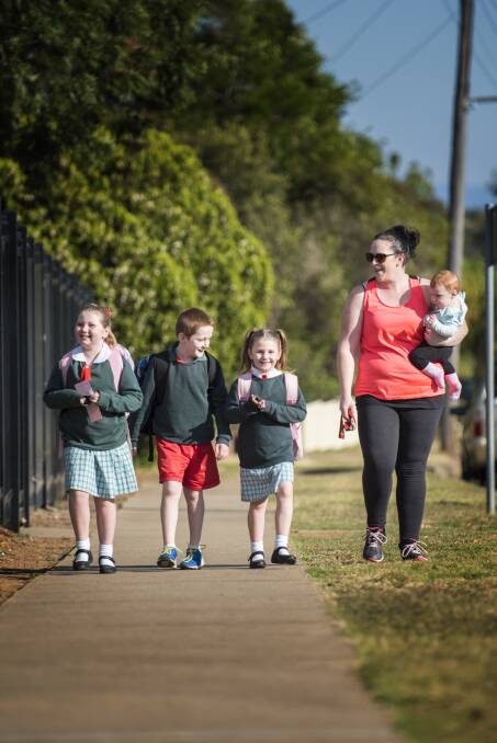 HEALTHY HABITS: Jasmin, Seth, Emily, Louise and baby Brooklyn Shanley are ready to walk to school. 150517PHA59