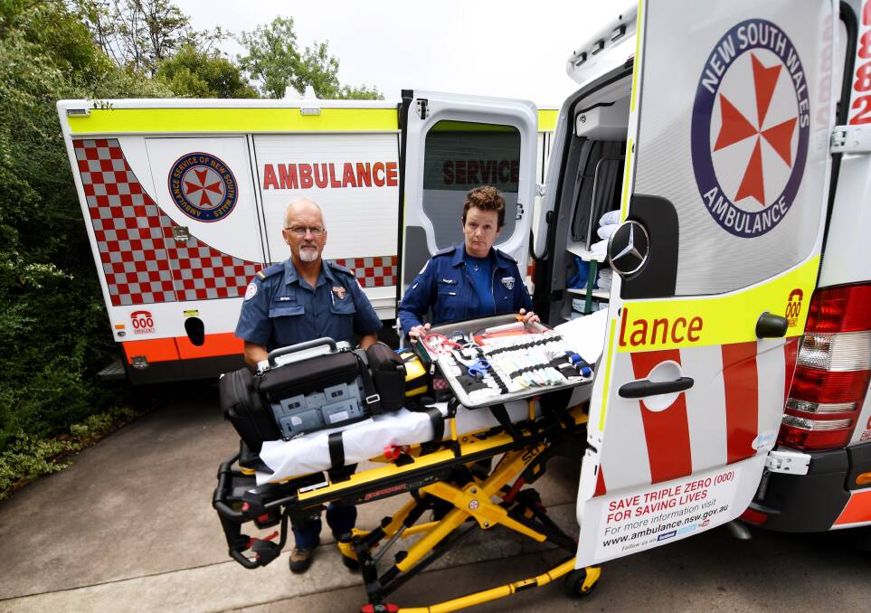 STAY SAFE: Paramedics Brian Bridges and Meryn Roberts have urged locals not to take risks on the roads this holiday season. Photo: Gareth Gardner 300717GGE06