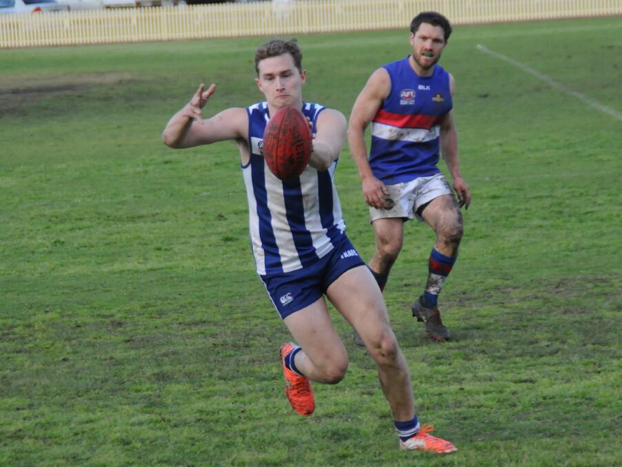 KEEP YOUR EYES ON THE BALL: Alex Hudson prepares to put in a kick for the Tamworth Kangaroos during their preliminary final victory against Gunnedah.