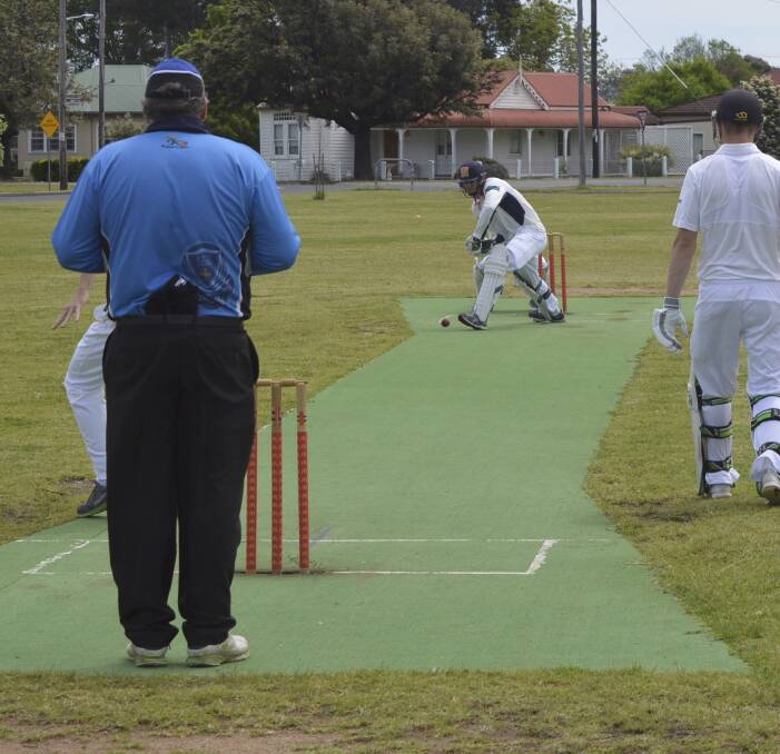 KEEP YOUR HEAD DOWN: A watchful Tom Scoble defends a delivery during his innings of 44 for Inverell against Narrabri in Country Plate cricket action on Sunday. Photo: Harold Konz.