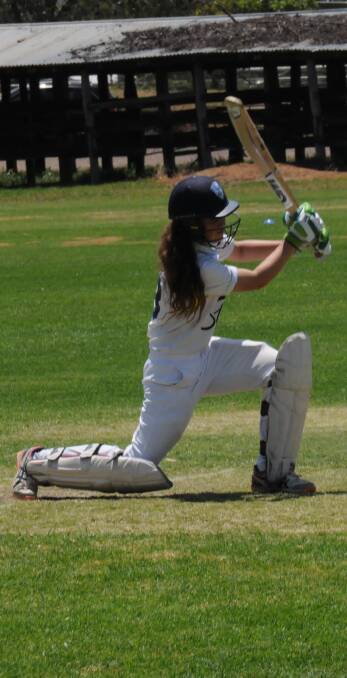 ELEGANT: Jess Davidson drives down the ground at Longmuir Oval during her innings of 11 for Tamworth Blue against Gunnedah in under 14 cricket.