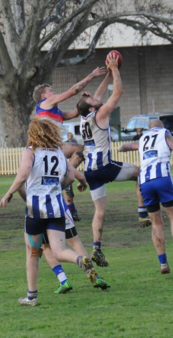CLEAN CATCH: Brad Rees marks the ball for the Tamworth Kangaroos despite a Gunnedah defender coming from behind during Saturday's preliminary final.