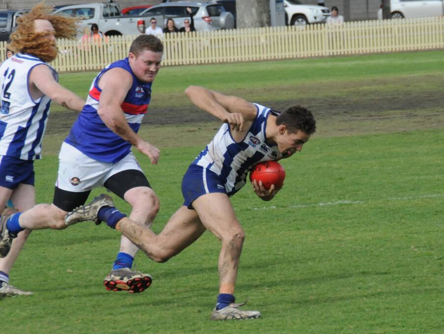 BALANCING ACT: Tamworth's Daniel Leon struggles to maintain his footing as he tries to break clear for the Kangaroos in the TAFL preliminary final at No. 1 Oval.