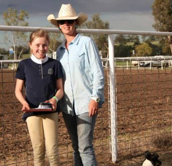 Gymkhana gems: Annalise Martin, pictured here with Shannon Stewart, holds her Sylvia Mills Memorial Trophy after taking out both the memorial trophy as well as the District U17 girl champion at the annual Mullaley Gymkhana.
