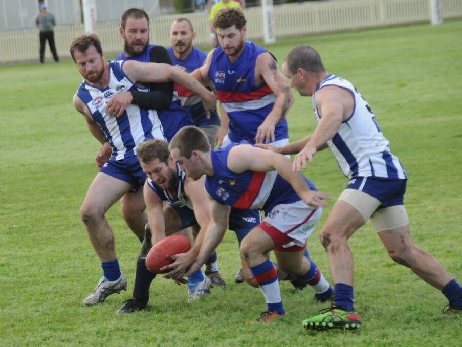 I WANT IT: Tamworth Kangaroos and Gunnedah Bulldogs AFC players are desperate to secure the football during Saturday's preliminary final in Tamworth.