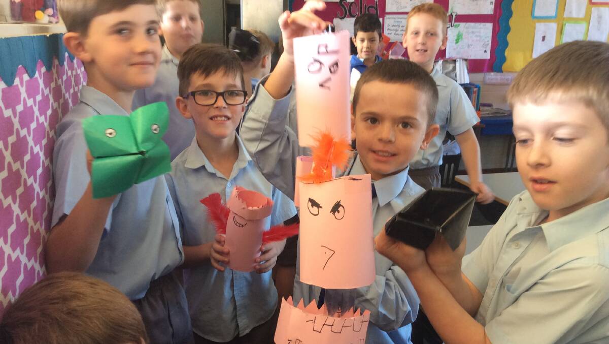 The St Ed's boys of 3L show off their puppets made in drama last week.