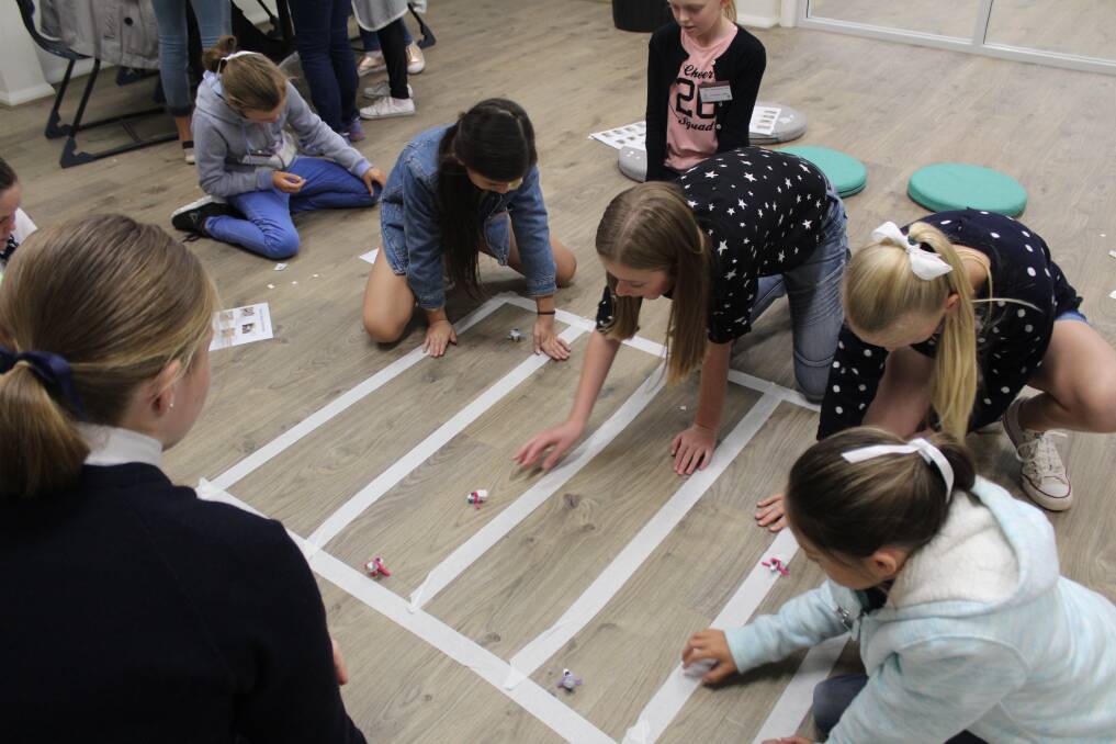 A bristle bots race captured the attention of these girls attending Experience Day as they found out what school life is like at Calrossy.