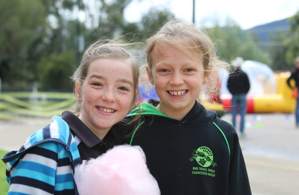 Carinya's Olivia Turnbull and Jessie Fotheringham enjoying the fairy floss at the school's fun day.
