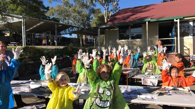 Artist on the Plains - Hands in the Air - Werris Creek Students enjoying the workshop which included marbelling, gravity fed painting and tie dying.