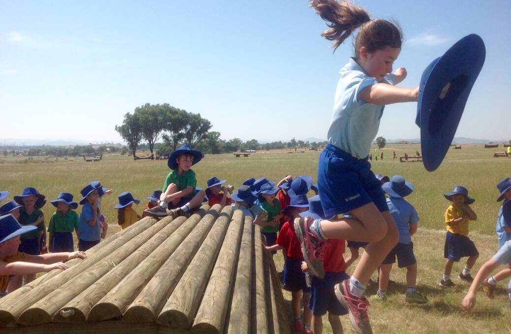 Olivia Murray of 1P flies over the obstacles.