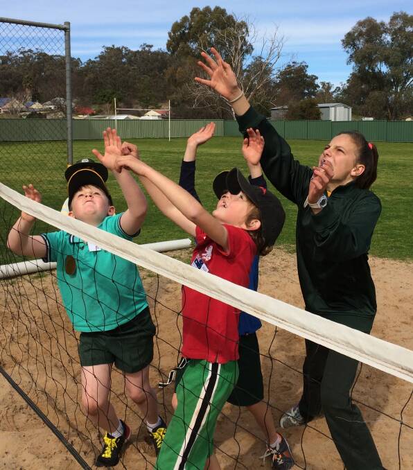 Team Wallabadah gets into the Olympic spirit with a game of beach volleyball.