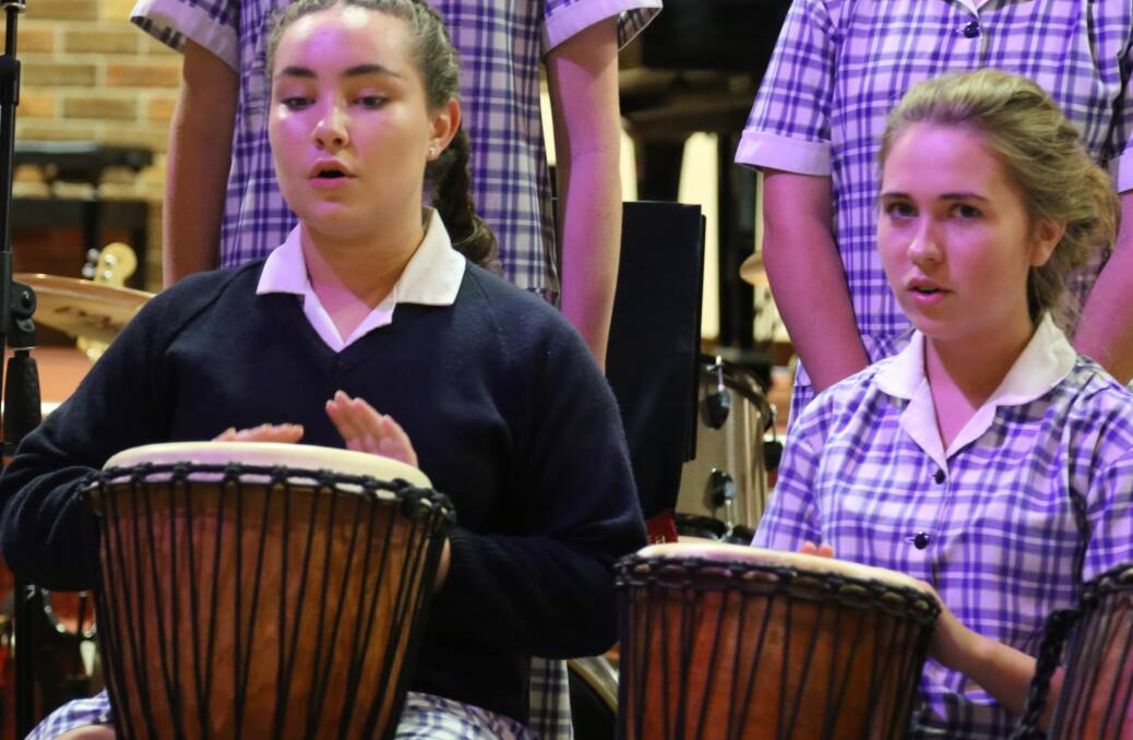 Sabrina Mureau, left, and Marni Barry formed part of a special Year 8 ensemble performance at Calrossy’s special music event.